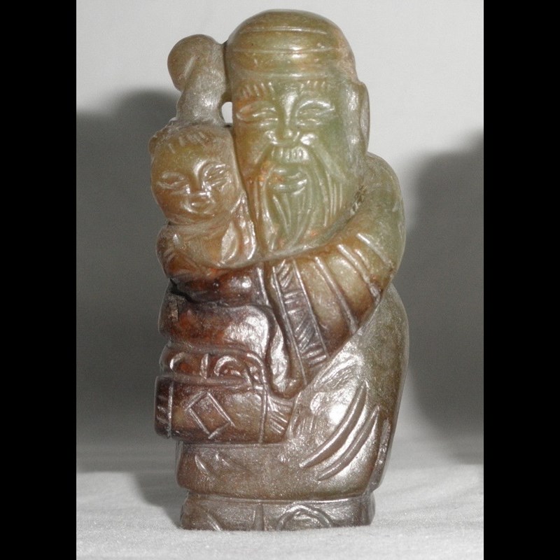 Rare Yuan or early Ming  jade depicting Shoulao (or Shouxing?) with a child