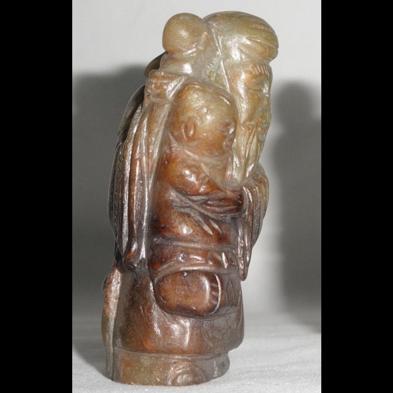 Rare Yuan or early Ming  jade depicting Shoulao (or Shouxing?) with a child